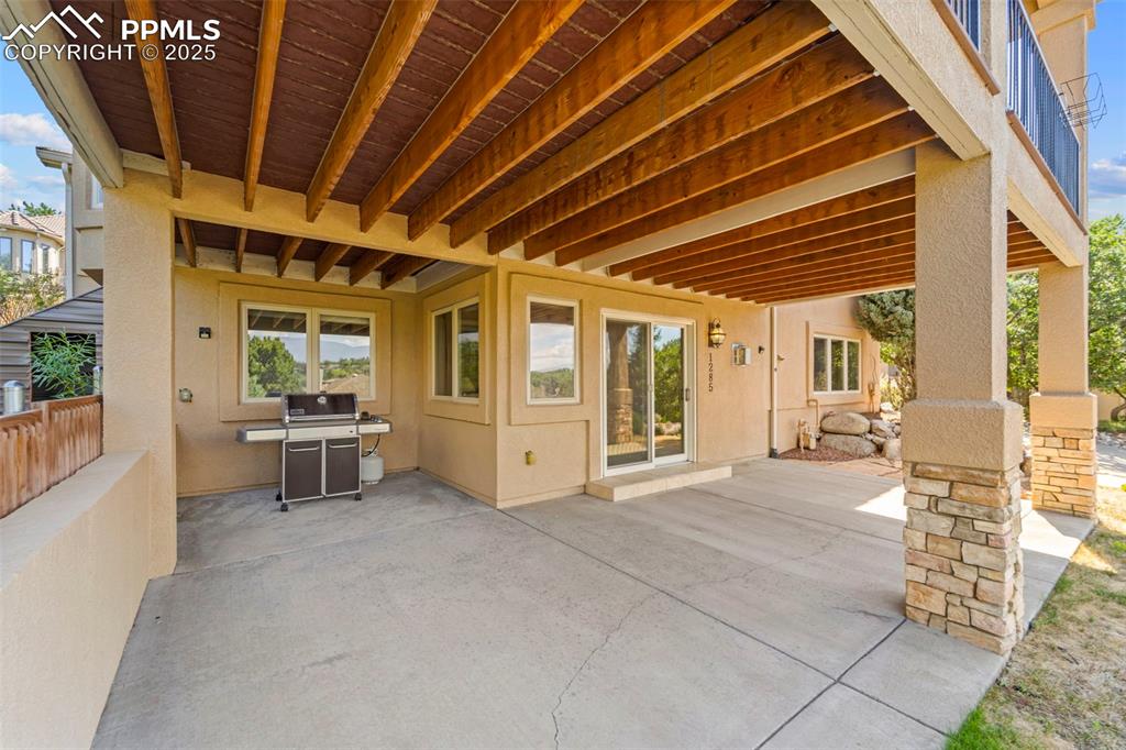 Image 15 of 33: Walkout on lower level to covered cement patio
