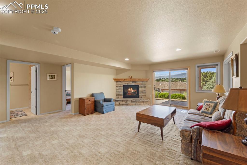 Image 16 of 33: Full bathroom and bedroom off lower level family room