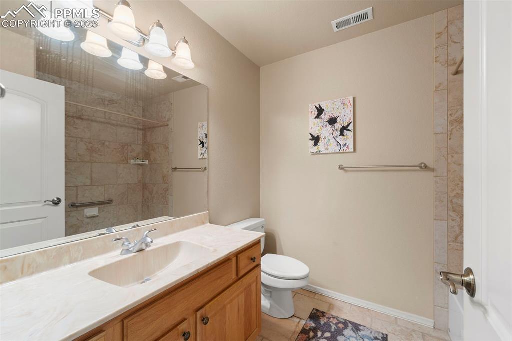 Image 18 of 33: Lower level full bath