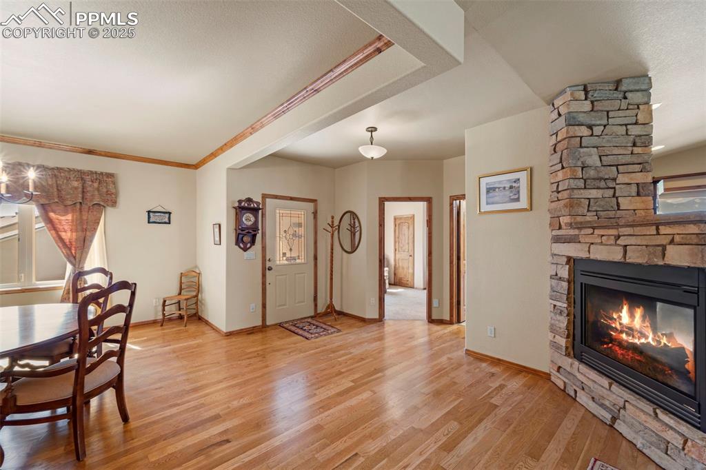 Image 29 of 33: Entry area with bedroom and bathroom, plus formal dining