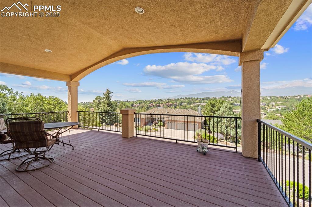 Image 8 of 33: Kitchen walks out to massive deck protecting you from the weather while you