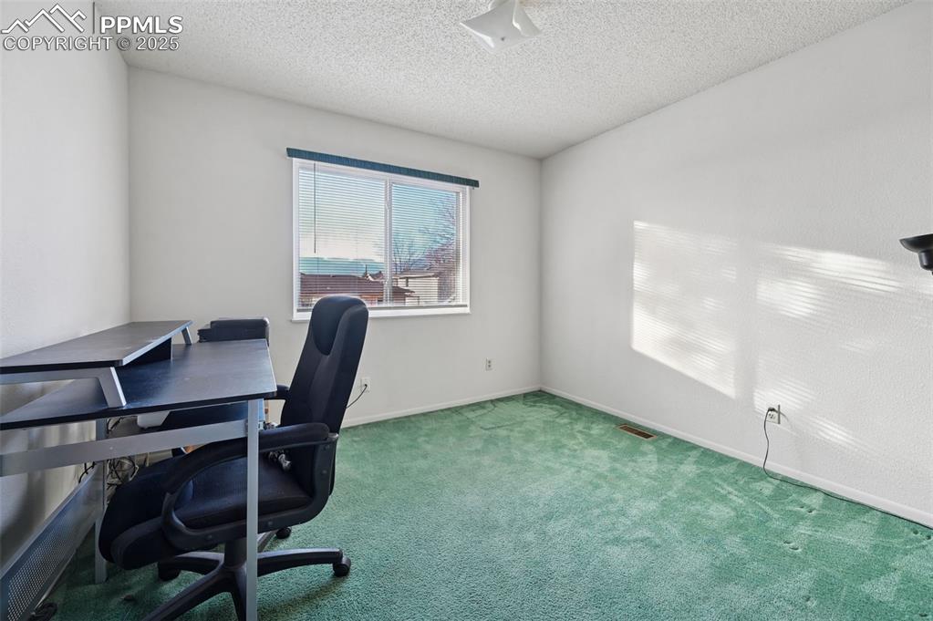 Image 32 of 39: Upper Level Bedroom