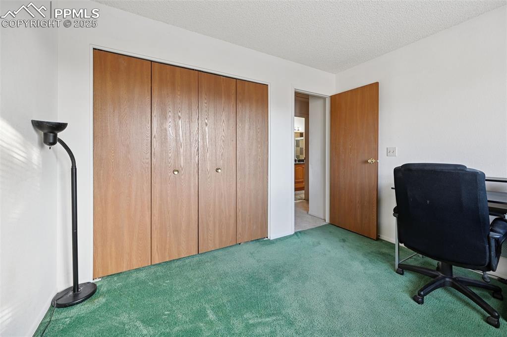 Image 33 of 39: Upper level Bedroom