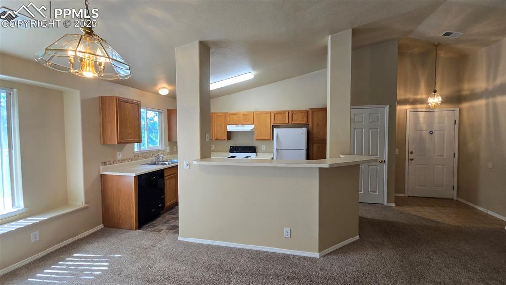 Image 8 of 26: Breakfast bar off kitchen