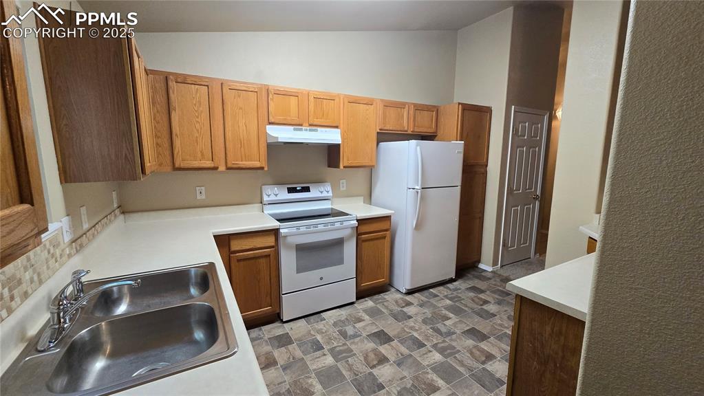 Image 9 of 26: Brand new flooring and oven in kitchen