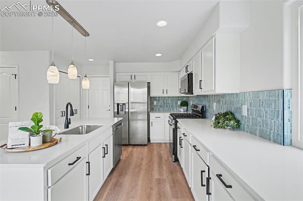 Image 10 of 40: Refined Kitchen with Elevated Finishes