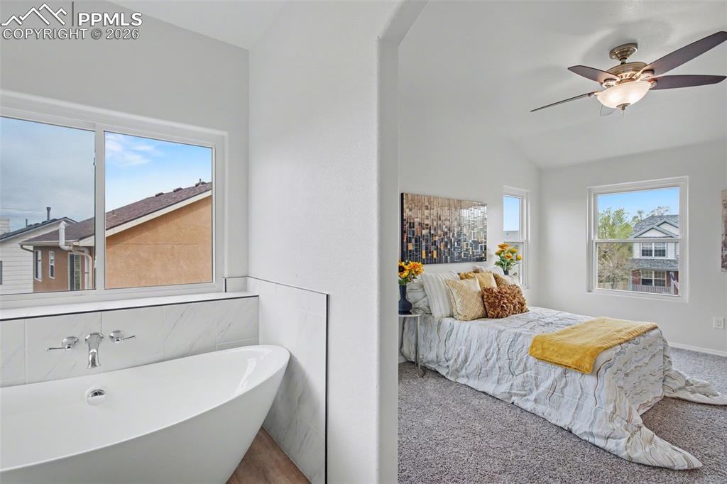 Image 21 of 40: Spa-Like Soaking Tub Bathed in Natural Light