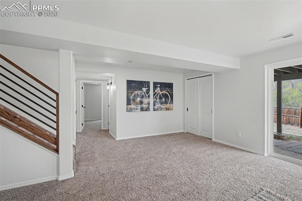 Image 28 of 40: Open Basement Designed for Living and Entertaining