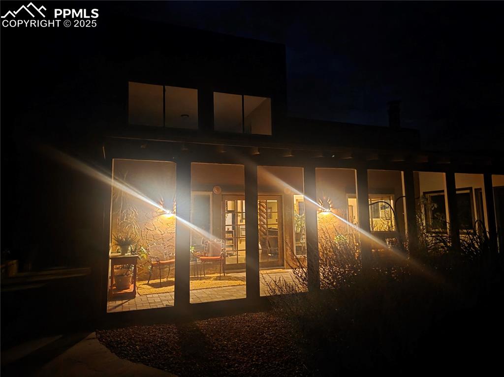 Image 20 of 42: Rear view of property with french doors