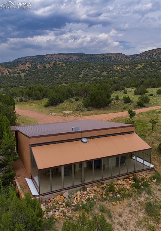 Image 22 of 42: View of subject property with a mountain backdrop