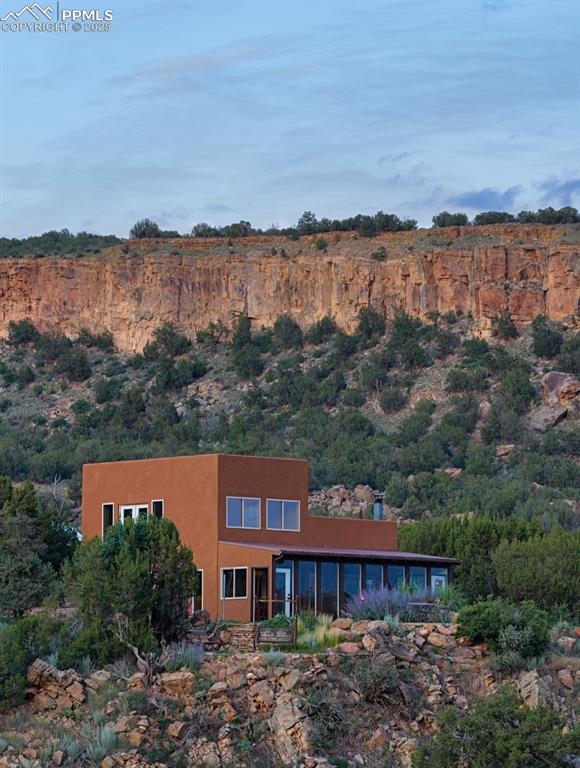 Image 28 of 42: Back of house featuring stucco siding
