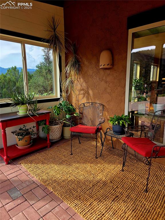 Image 4 of 42: View of patio / terrace featuring a sunroom