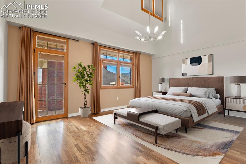 Image 18 of 50: Spacious main level primary suite. Virtually staged