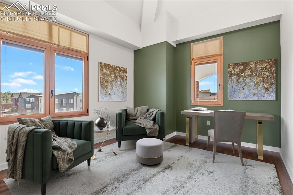 Image 23 of 50: Main level secondary bedroom. Virtually staged