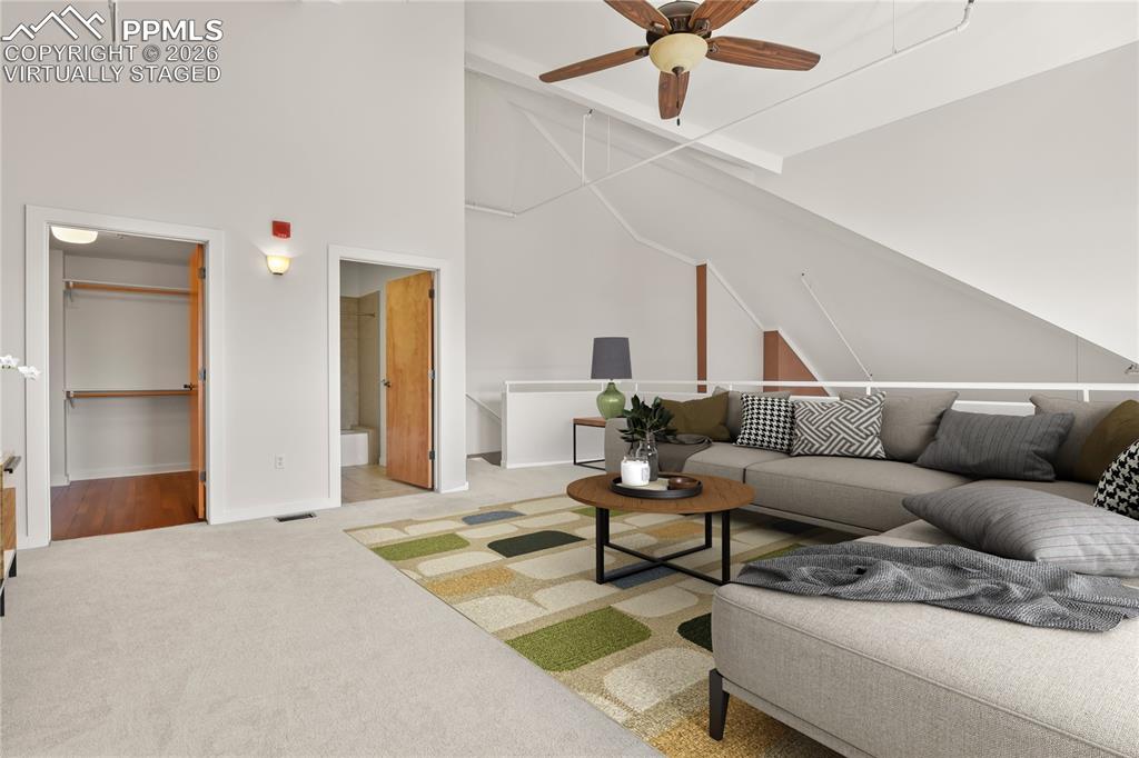 Image 30 of 50: Upper level loft area. Virtually staged.