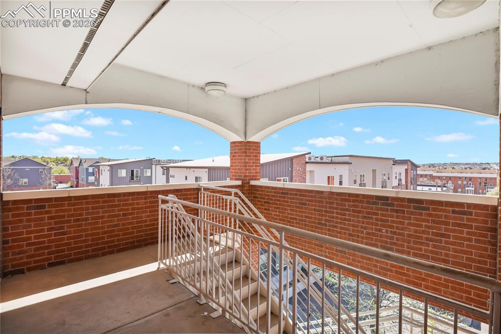 Image 34 of 50: Access from rear of the unit to emergency exit stairs