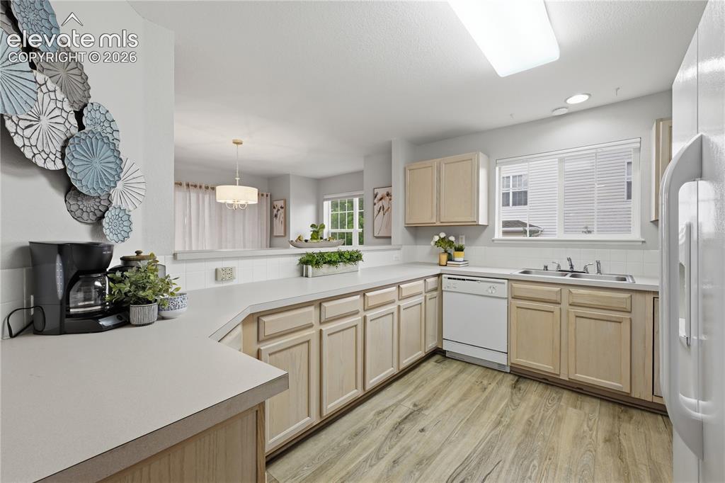 Image 4 of 26: Open to dining room great for conversations while preparing food