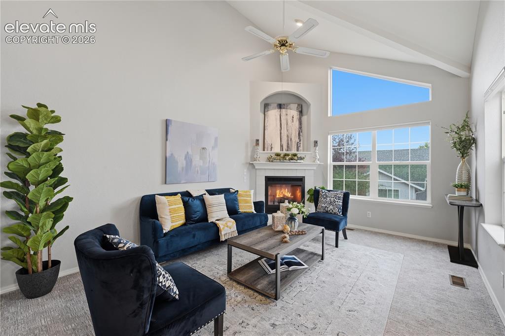 Image 7 of 26: The vaulted ceiling create an open airy vibe in this space