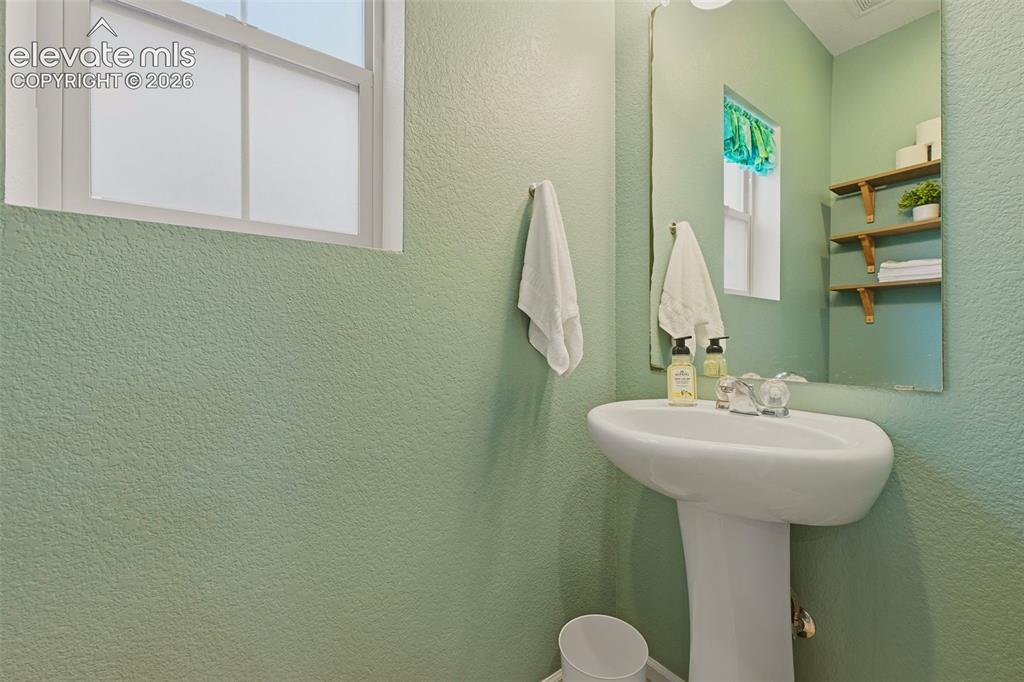 Image 16 of 36: Main level 1/2 bath
