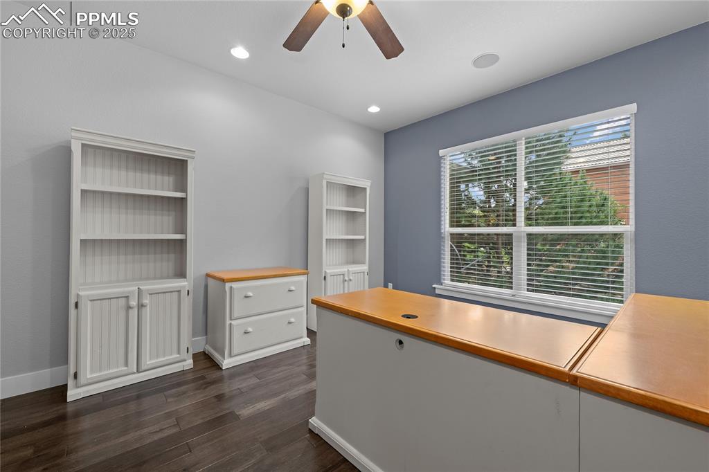 Image 10 of 24: Office featuring dark wood-style floors, a ceiling fan, and recessed lighti