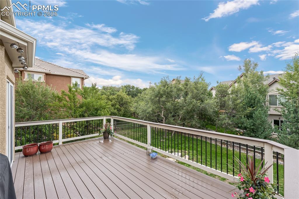 Image 22 of 24: Deck with view of treed area
