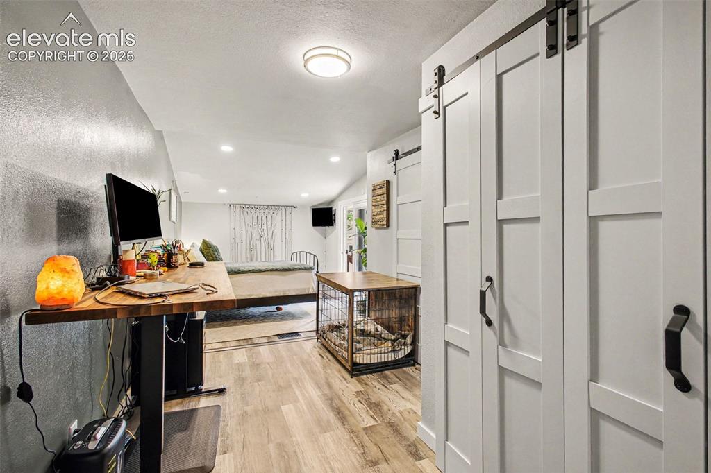 Image 11 of 36: Expanded master with barn doors