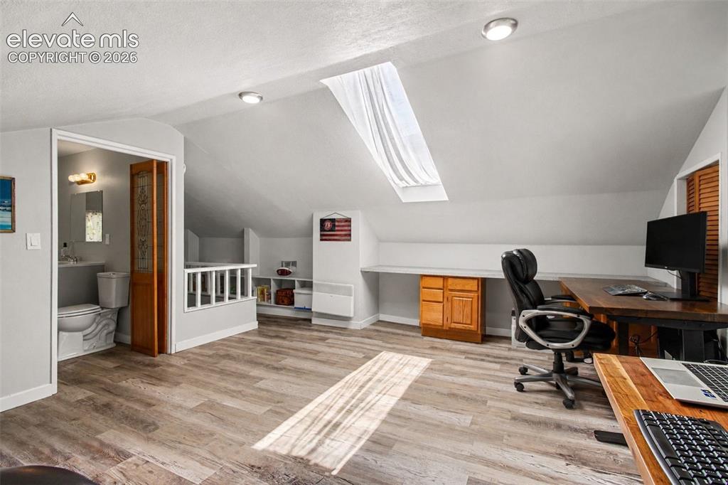 Image 15 of 36: Huge space with skylight and built-ins!