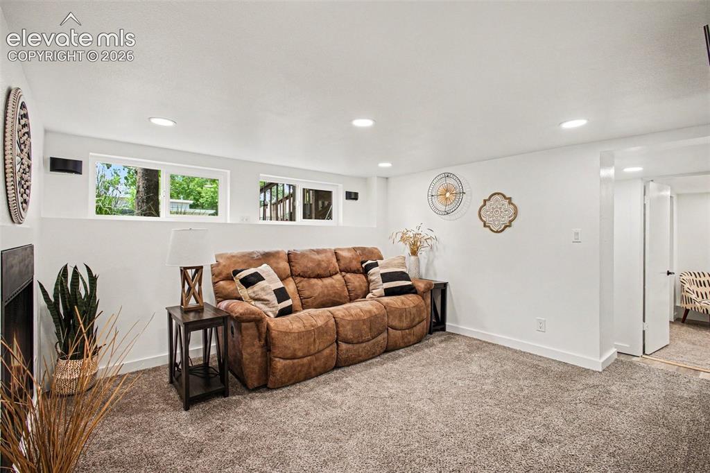 Image 18 of 36: Basement family room with separate outside entrance!