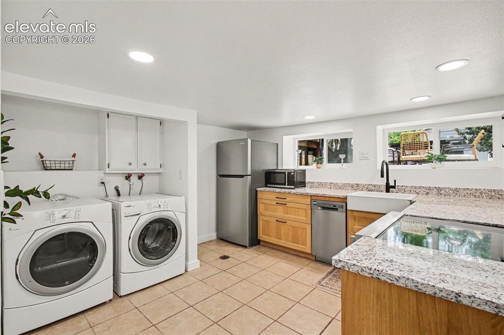 Image 21 of 36: Separate laundry in basement!