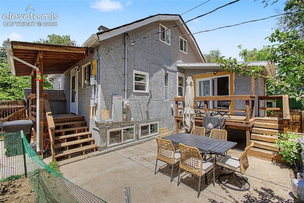 Image 27 of 36: Covered decks with 2 walkouts from the main and patio perfect for entertain