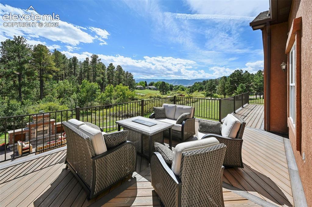 Image 32 of 48: Sitting area with mountain views - electric rough in for future awning 