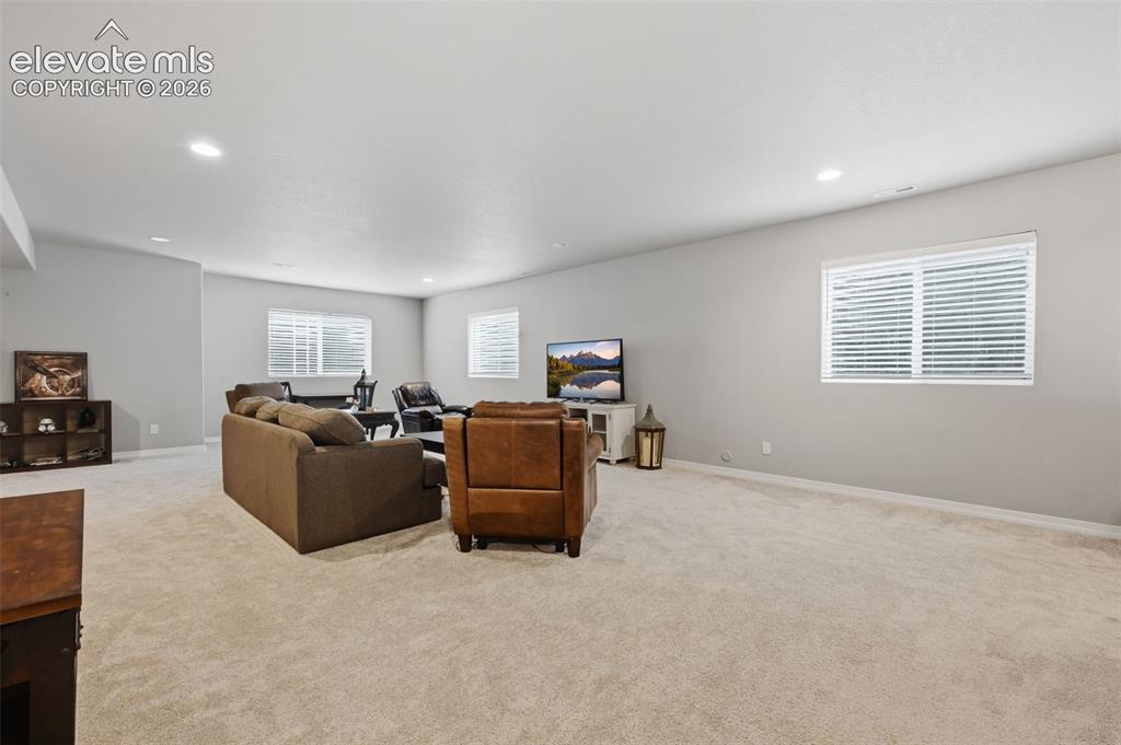 Image 24 of 33: Another view of the basement entertaining area!