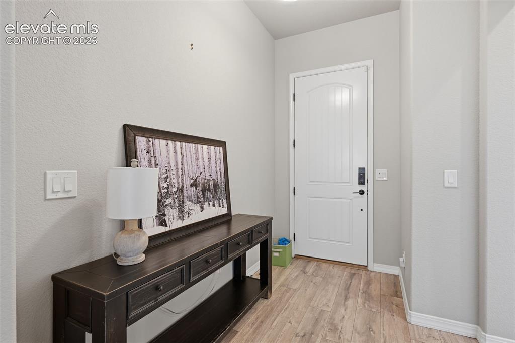 Image 5 of 33: Wide entry and beautiful plank flooring!