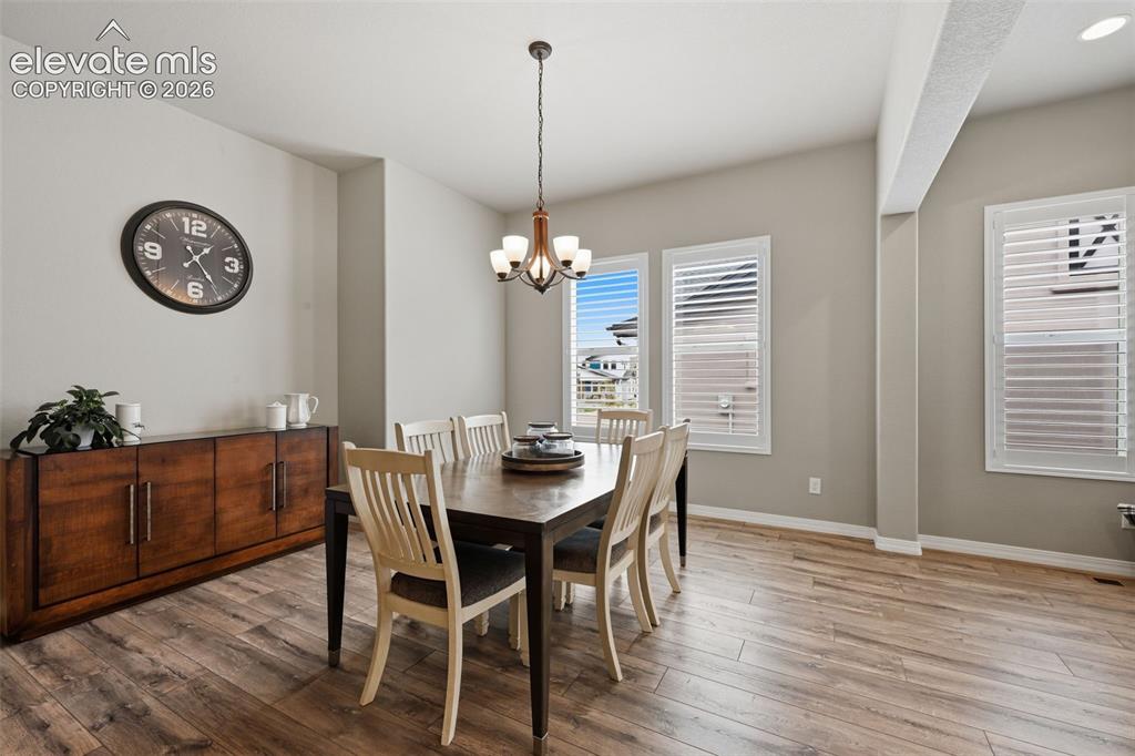 Image 7 of 33: Spacious dining area with plantation shutters!