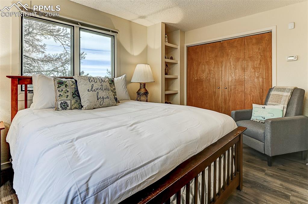 Image 32 of 41: Bedroom, LVP floors, casement windows