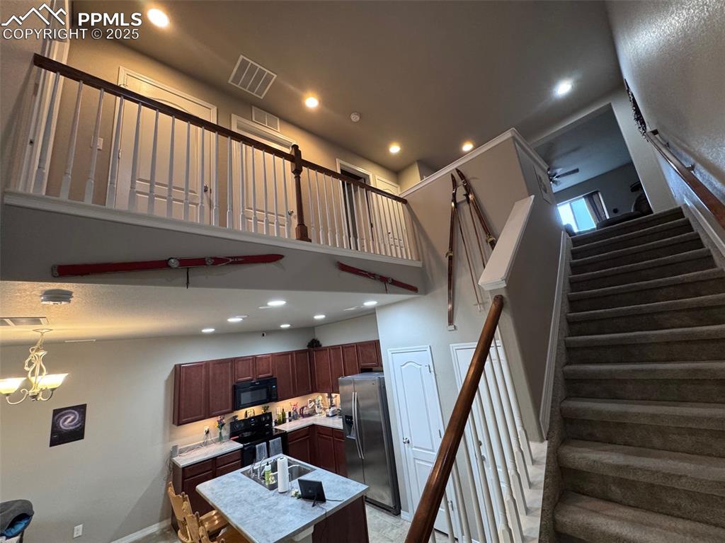 Image 15 of 31: Open Floorplan with Upper & Lower Spindle Railings