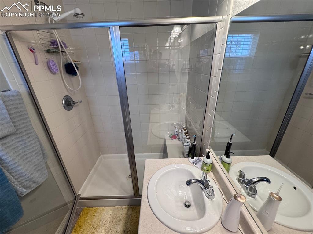 Image 29 of 31: Glass Enclosed Shower in Primary Bathroom