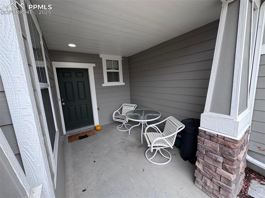 Image 4 of 31: Doorway to Home Featuring a Covered Porch
