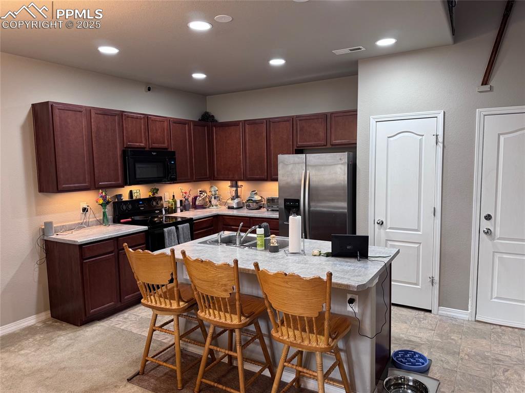 Image 7 of 31: Kitchen has Lots of Cabinets & a Pantry