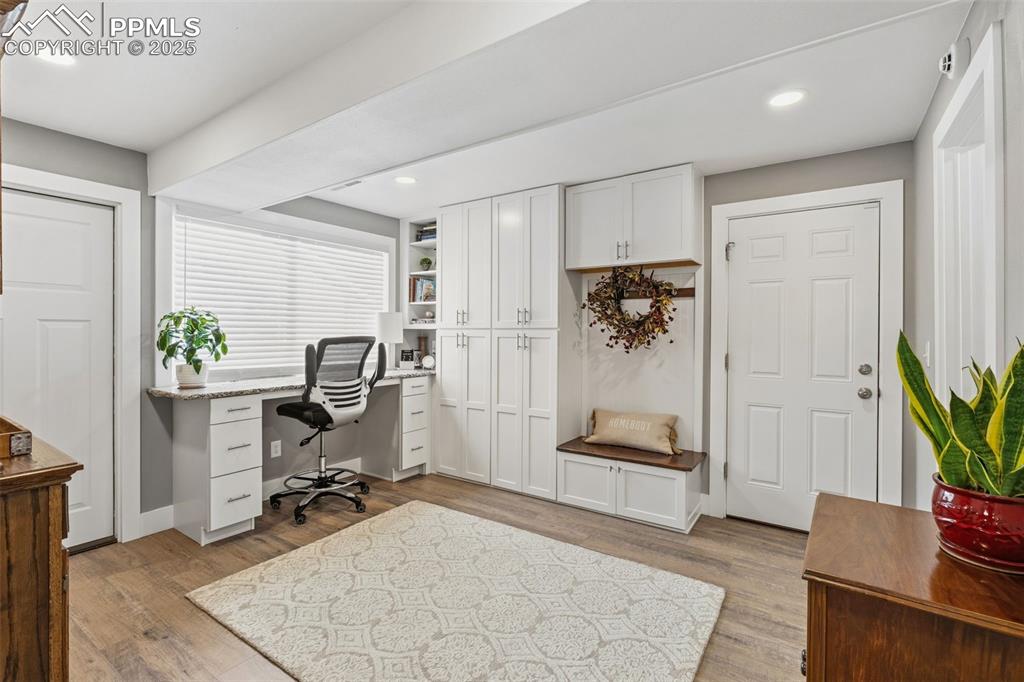 Image 23 of 45: Mud room + craft room or office space