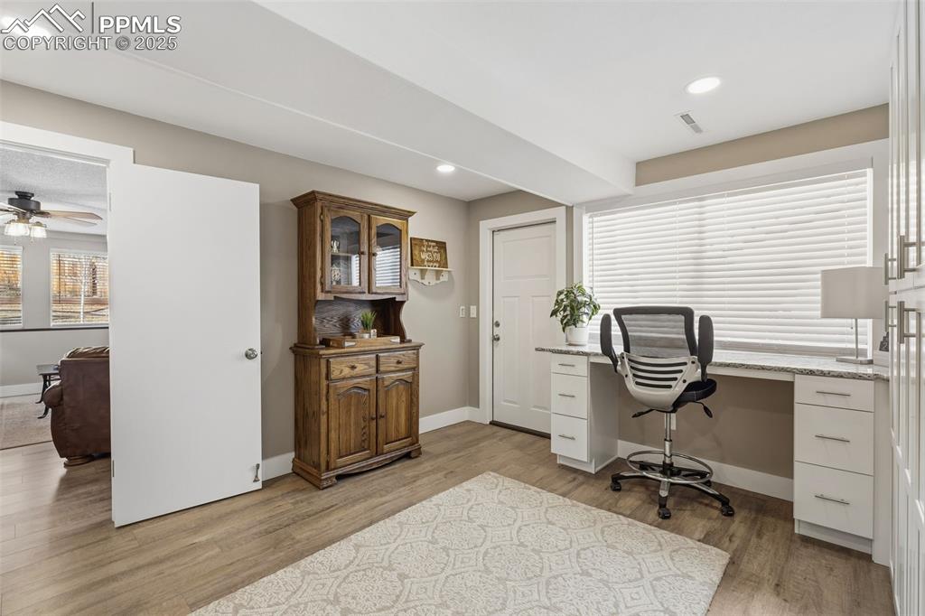 Image 25 of 45: Mud room + craft room or office space