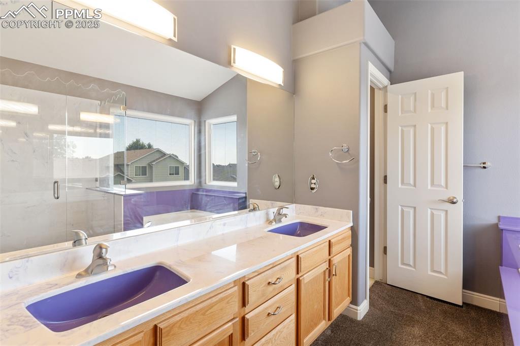 Image 15 of 33: Dual vanity plus storage alcoves in the toilet room