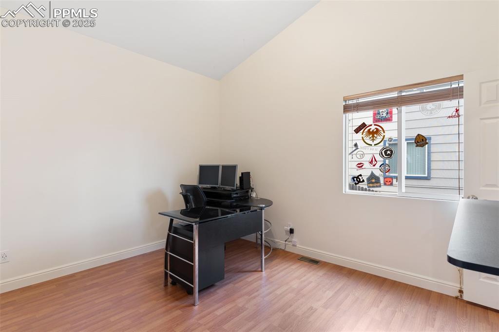 Image 17 of 33: 2nd bedroom on main level - could be an office