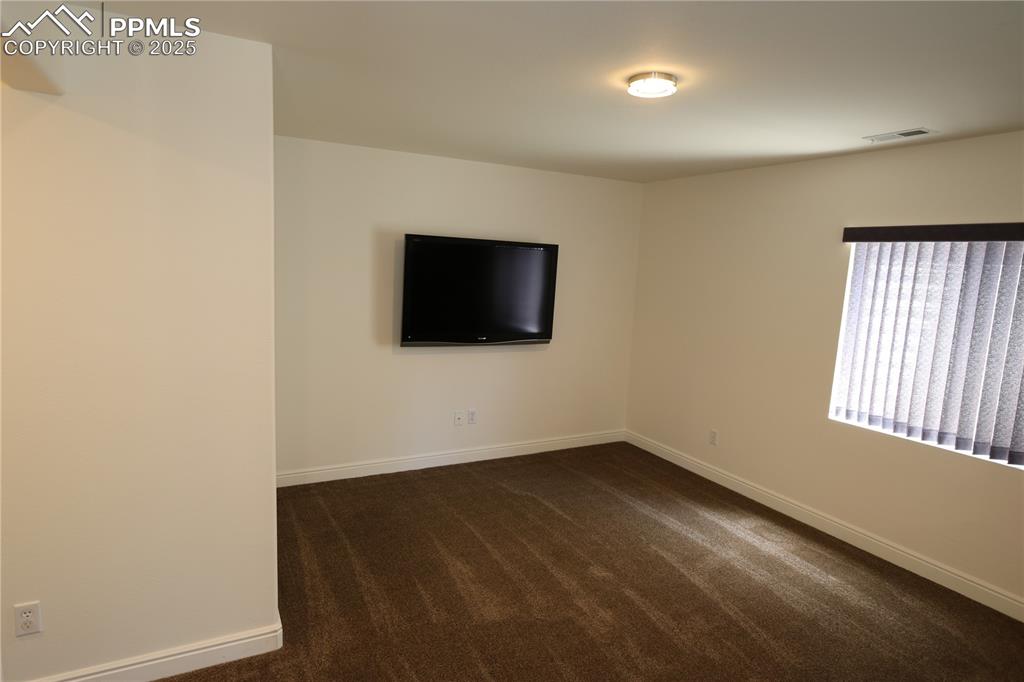 Image 19 of 33: Basement media area