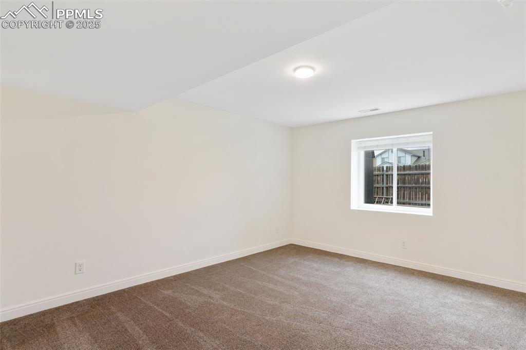 Image 23 of 33: 3rd bedroom, located in basement