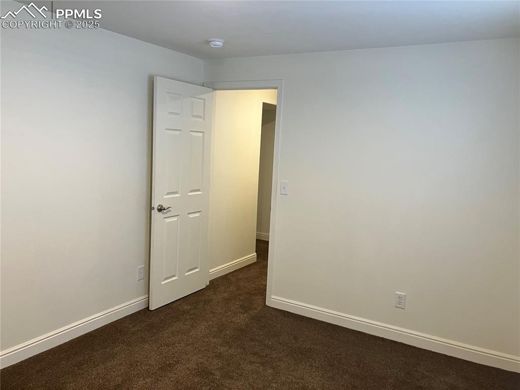 Image 26 of 33: 4th bedroom, located in basement (empty)