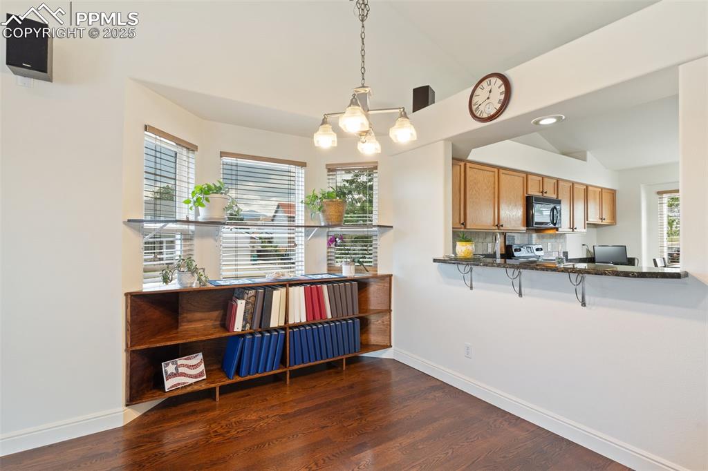 Image 8 of 33: There is room for a dining table or stools at the breakfast bar
