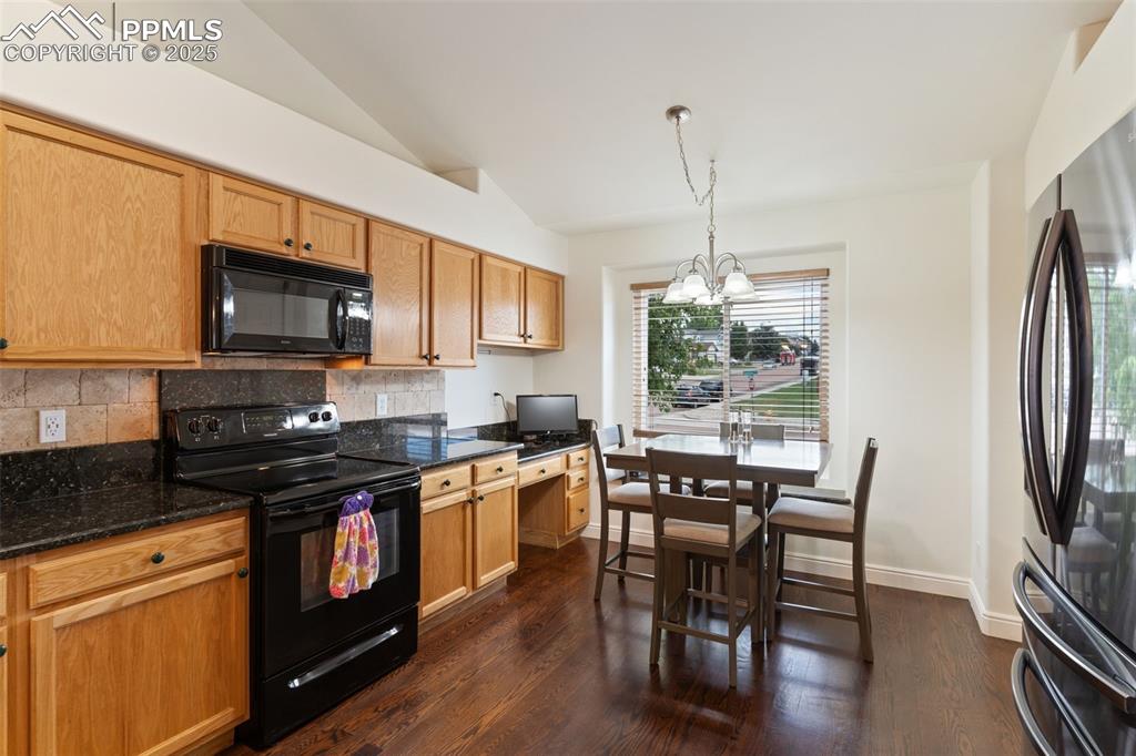 Image 9 of 33: Lots of cabinets and a large pantry
