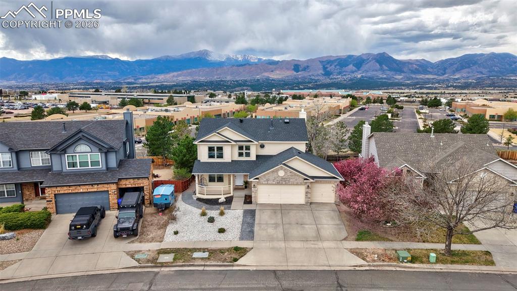 Image 1 of 50: Aerial view of residential area with a mountainous background