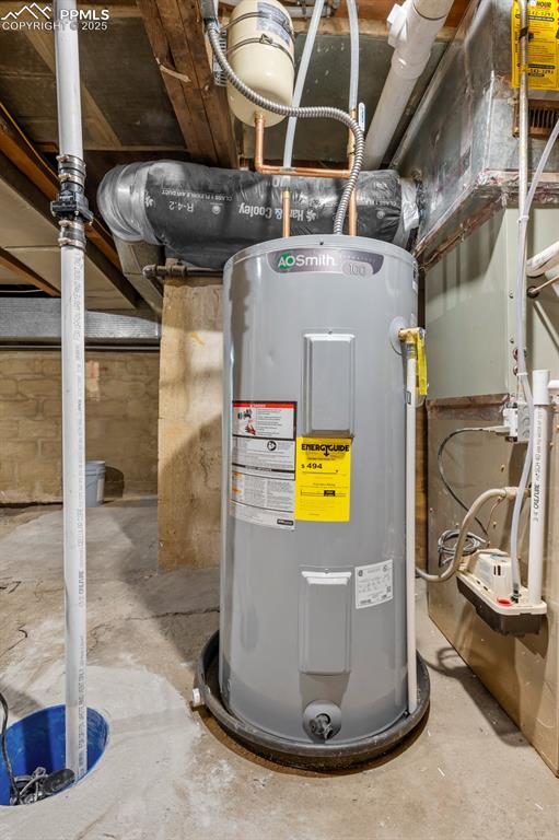Image 43 of 50: Utility room with electric water heater